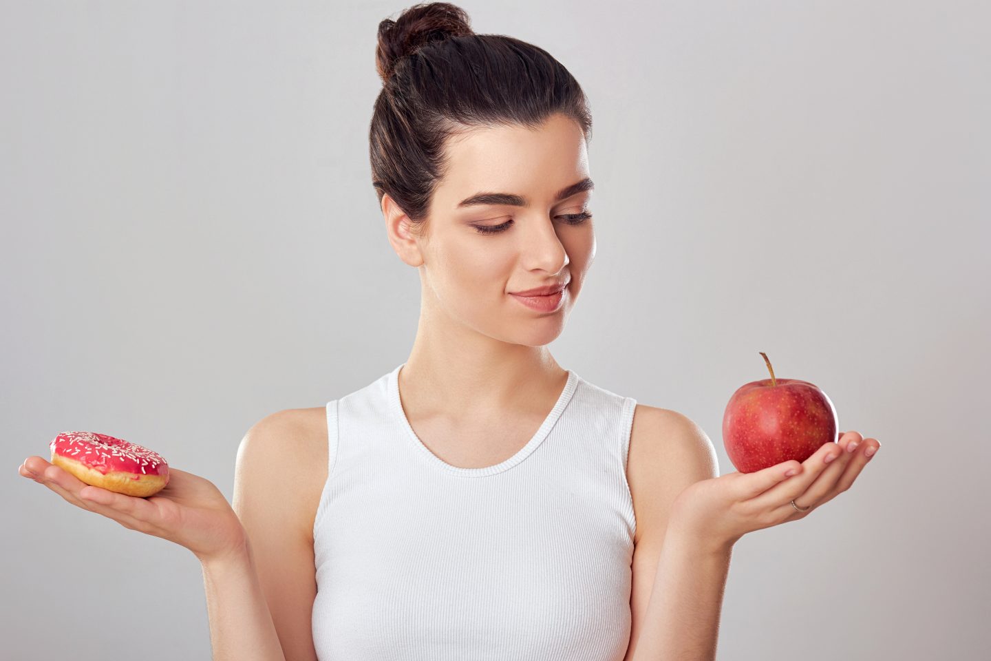 Woman Making Choice Between Apple And Donut. Dieting Concept. Br Immunity Lesson 8